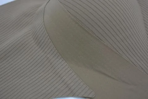 Materials, light green, brown thin fabric with texture and small lines. Stock Photos