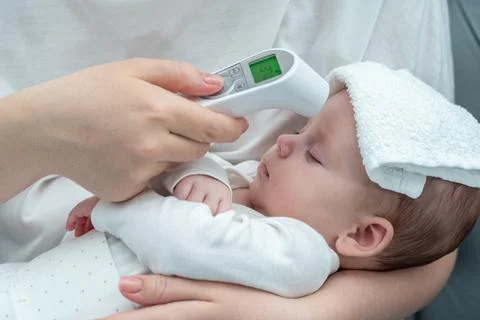 Maternal concern in the digital age. Concept of modern ways to ensure infant Stock Photos