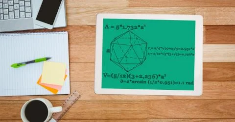 Math diagram and equations on digital tablet by note pad Stock Photos