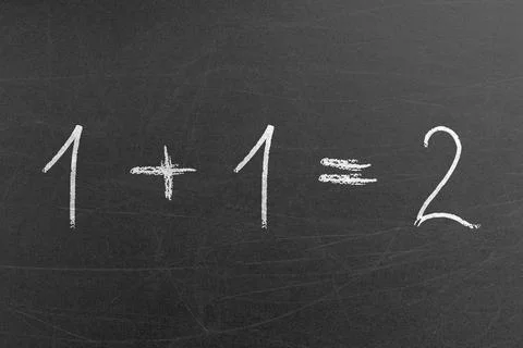 Math equation for pre-school students in the school handwritten on a blackboard Stock Photos