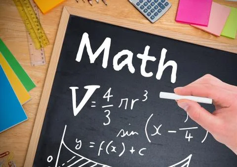Math equations written on blackboard with chalk in hand Stock Photos