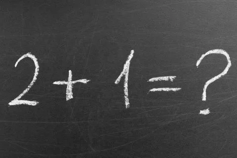 Math formula was handwritten by a kid in the school on the blackboard Stock Photos