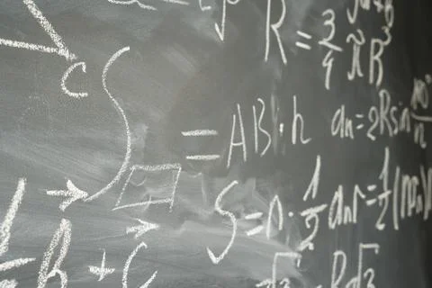 Math formulas on black board Foto stock