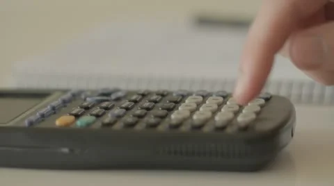 Math homework with calculator and pen Vídeo Stock 11863565