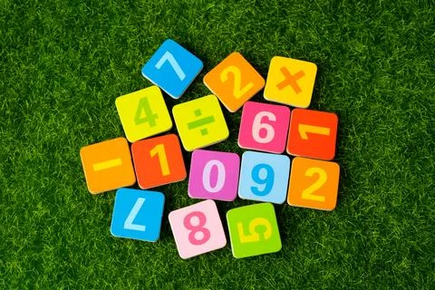 Math number colorful on grass background, Education study mathematics learn.. Фото