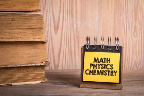 Math Physics Chemistry. Stack of books and a notebook on a shelf Stock Photos