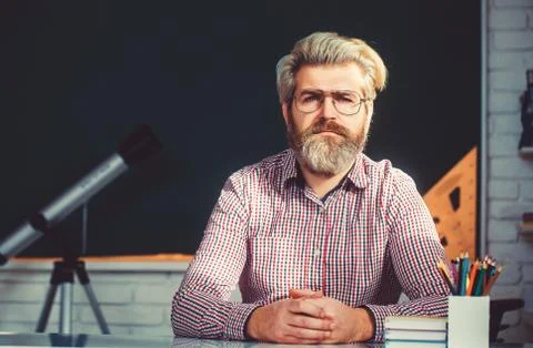 Math s teacher explaining arithmetic sums to elementary children. Stock Photos