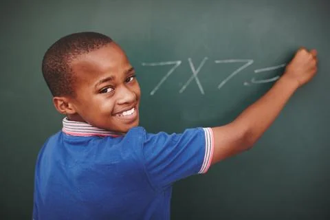 Math, student and portrait at chalkboard in classroom with problem solving Stock Photos