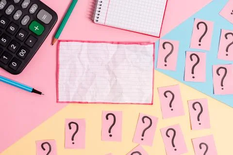 Math stuff with scribbled and crumbling papers plus writing equipment on Stock Photos