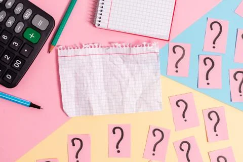 Math stuff with scribbled and crumbling papers plus writing equipment on Stock Photos