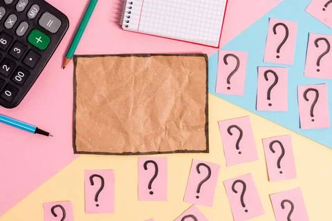 Math stuff with scribbled and crumbling papers plus writing equipment on c... Stock Photos