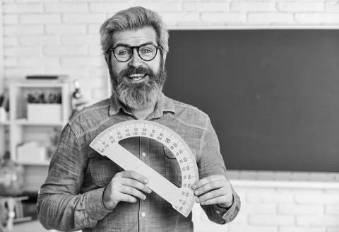 Math subject. Study mathematics. Man teacher mentoring school projects. Science Stock Photos