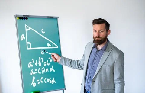 Math teacher in classrom back to school Stock Photos