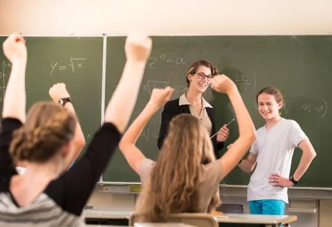 Math teacher standing in front of students who are well prepared Stock Photos