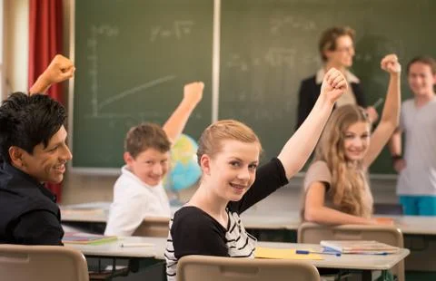Math teacher standing in front of students who are well prepared Stock Photos