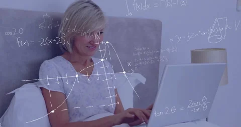 Mathematical equations and graphs animation over woman using laptop in bed Stock-Footage 303540290