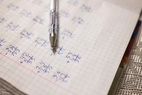 Mathematical examples that the student wrote and solved. Sum and subtraction 스톡 사진