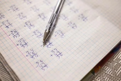 Mathematical examples that the student wrote and solved. Sum and subtraction Stockfoto's