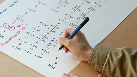 Mathematician writes a formula for adding fractions Stock Footage 166832887