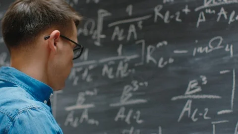 Mathematician Writes Long and Complex Math Equation/ Formula on Blackboard.  Stock Footage 86549871