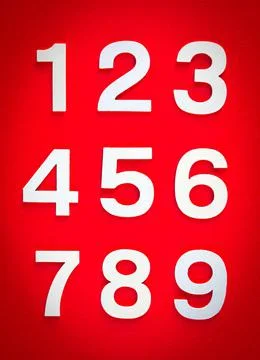 Mathematics background made with solid numbers. Isolated on red 스톡 사진