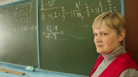 Mathematics teacher in the class at the Board Stock Footage 37874988