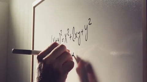 Mathematics teacher writing polynomial function on whiteboard Video stock 78188625