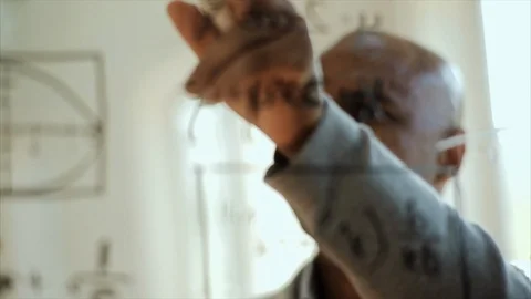 Mathematition making calculations on a clear board. 스톡 동영상 88406332