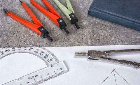 Mathemethics and geometry tools in the school and projecting. Stock Photos
