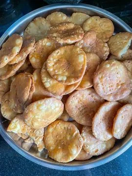 Mathri or matthi deep fried tea time snack made of whole wheat flour Photos