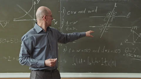 Maths Professor Solving Geometry Problems at Blackboard Stock Footage 155463247