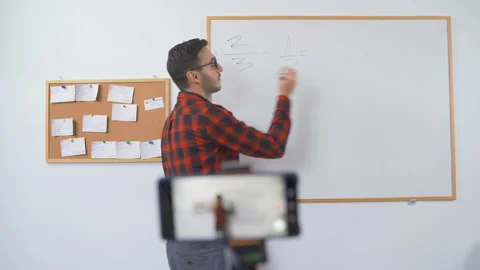 Maths teacher teaching remotely online Stock Footage 139338721