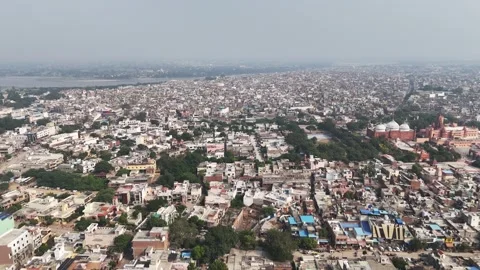 Mathura cityscape blends devotion and daily life—temples rising above packed Stock-Footage 328874768