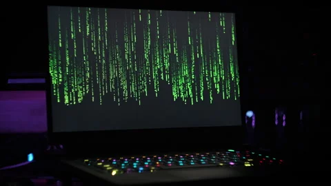 Matrix Code Rain on Laptop Screen in Dark Modern Room Stock Footage 262875739