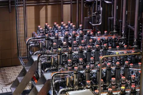 Matrix of mixproof separation valves in modern food or chemical factory Stock Photos