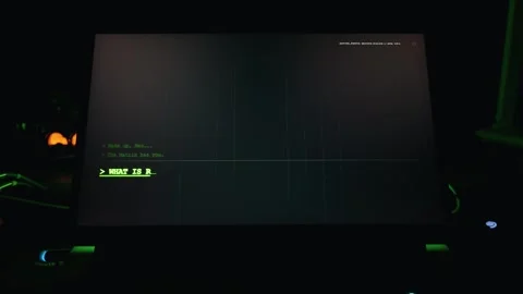 Matrix Terminal Interface Displaying Text on Laptop Screen in Dark Room Stock Footage 334729755