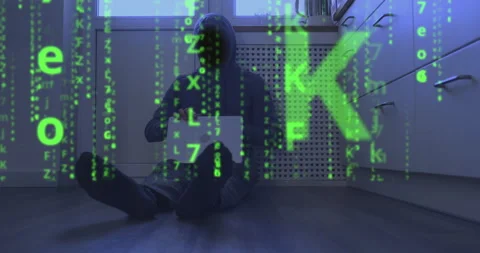 Matrix video effect, binary code instead of face of hooded programmer sitting on Stock Footage 237698180