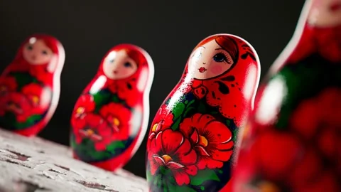 Matryoshka dolls placed in a circle. A camera follows one babushka after another Stock Footage 145766076