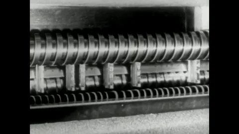 Mats, a chute, a stacker and an animation showing letter characters are shown Vídeos de archivo 79515732