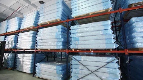 Mats production, mattress warehouse on production, skidder for mattresses Stock Footage