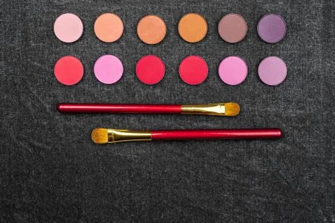 Matt eye shadows with brushes Stock Photos