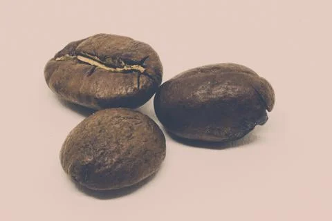 Matte Closeup of Three Roasted Coffee Beans Stock-Fotos