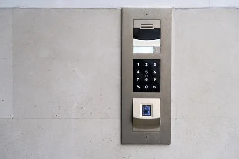 Matte metal intercom call panel with white digital buttons and fingerprint Stock Photos