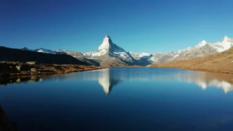 Matterhorn peak reflected in Stellisee Lake in Zermatt, Switzerland. Stock Footage