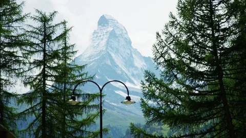 Matterhorn view with two trees in front - Shot on RED at 5K Stock Footage 79326970