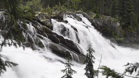 Matthew River falls drops out of Ghost Lake in mountains of Cariboo Stock Footage 152728880