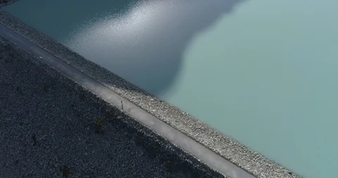 Mattmark dam with walking man, back traveling - Aerial 4K Stock Footage 116214824