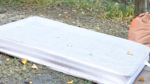 Mattress on the lawn for garbage Stock Footage 69185919