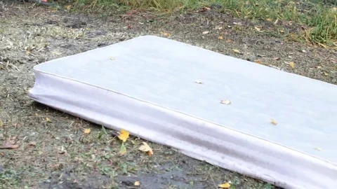 Mattress on the lawn for garbage Stock Footage 69186027