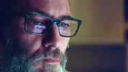 Mature Adult Man With Glasses Who Works At Night. Close Up Shot, Display Reflect Stock Footage
